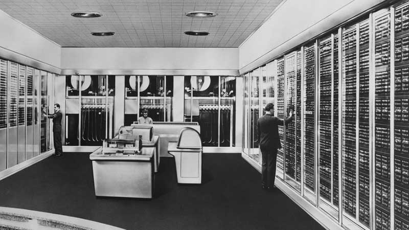 94202284 Historical photo of employees working in a computer room in the 1950s.